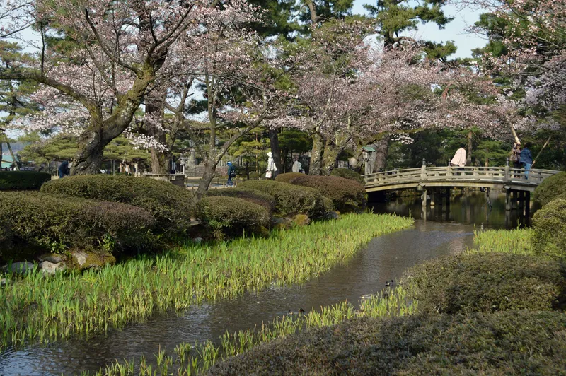 Kenrokuen Garden in Kanazawa with Kasumigaike pond and the two-legged Kotoji lantern backed by pines